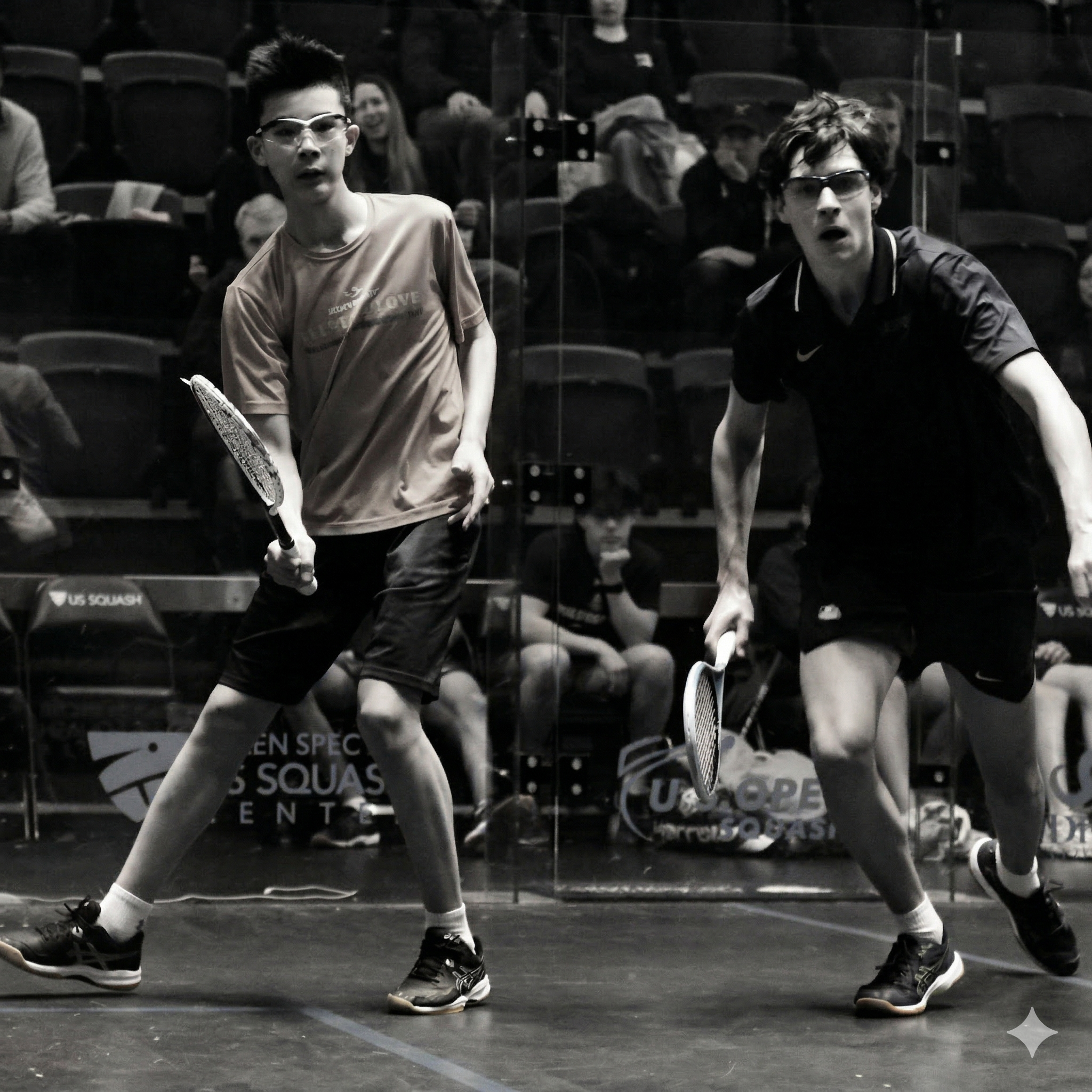 Two youth players competing at a squash camp